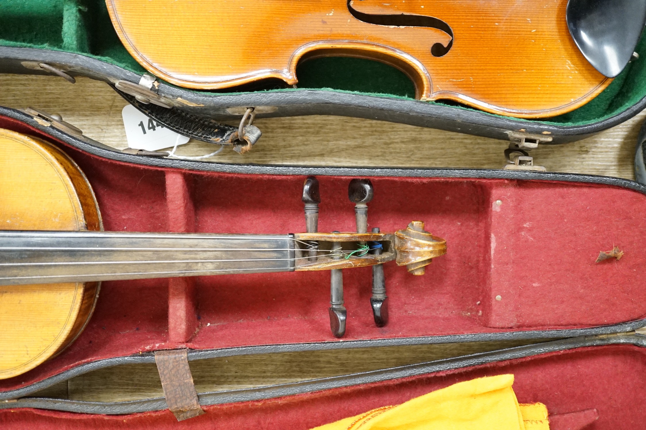 Two cased double back violins